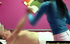 Asian masseur gives a sexy rub down
