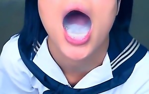 Spunk on beautiful japanese mouth