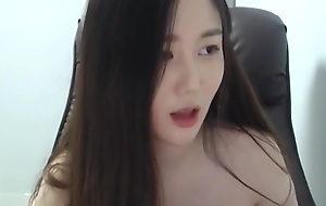Elegant Korean shows her round tits